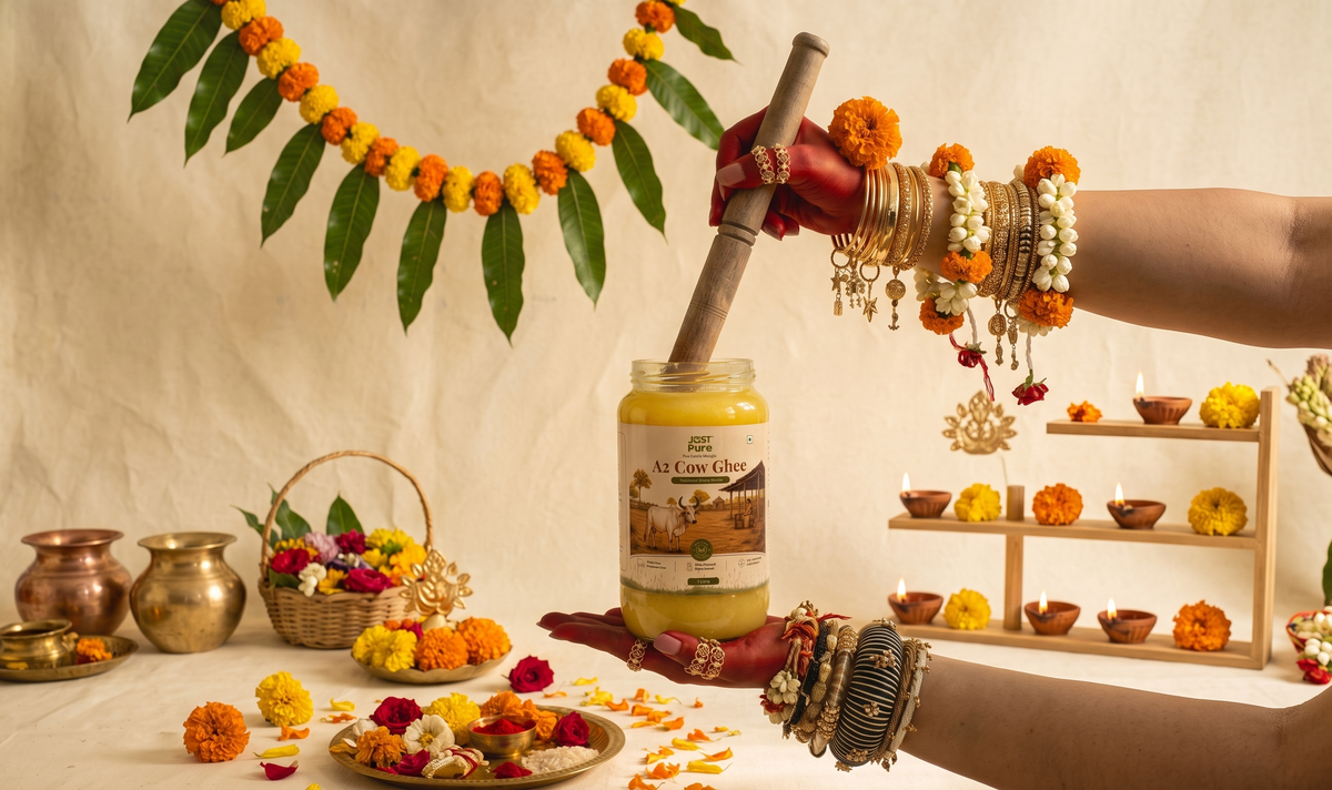 Hands holding a jar of Just Pure A2 Cow Ghee
