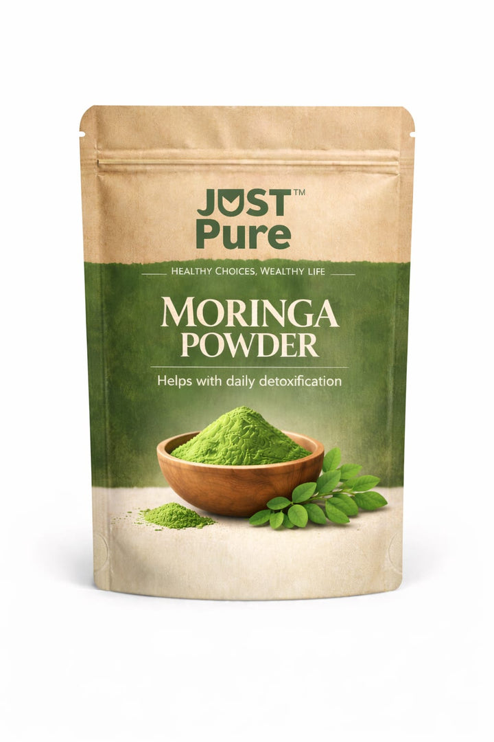 Just Pure Organic Moringa Powder in resealable kraft pouch, featuring green moringa powder in a wooden bowl with fresh moringa leaves on a white background